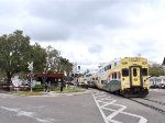 Sunrail Bombardier Bilevel Cab Car # 2001 leads a southbound mid afternoon Sunrail Train across the joint W. Lyman and S. New York Ave grade crossing in Winter Park after pulling out of the namesake depot 